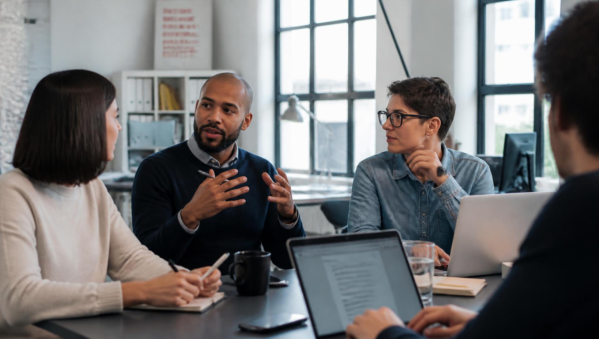 Flow State team in a candid working meeting in the office